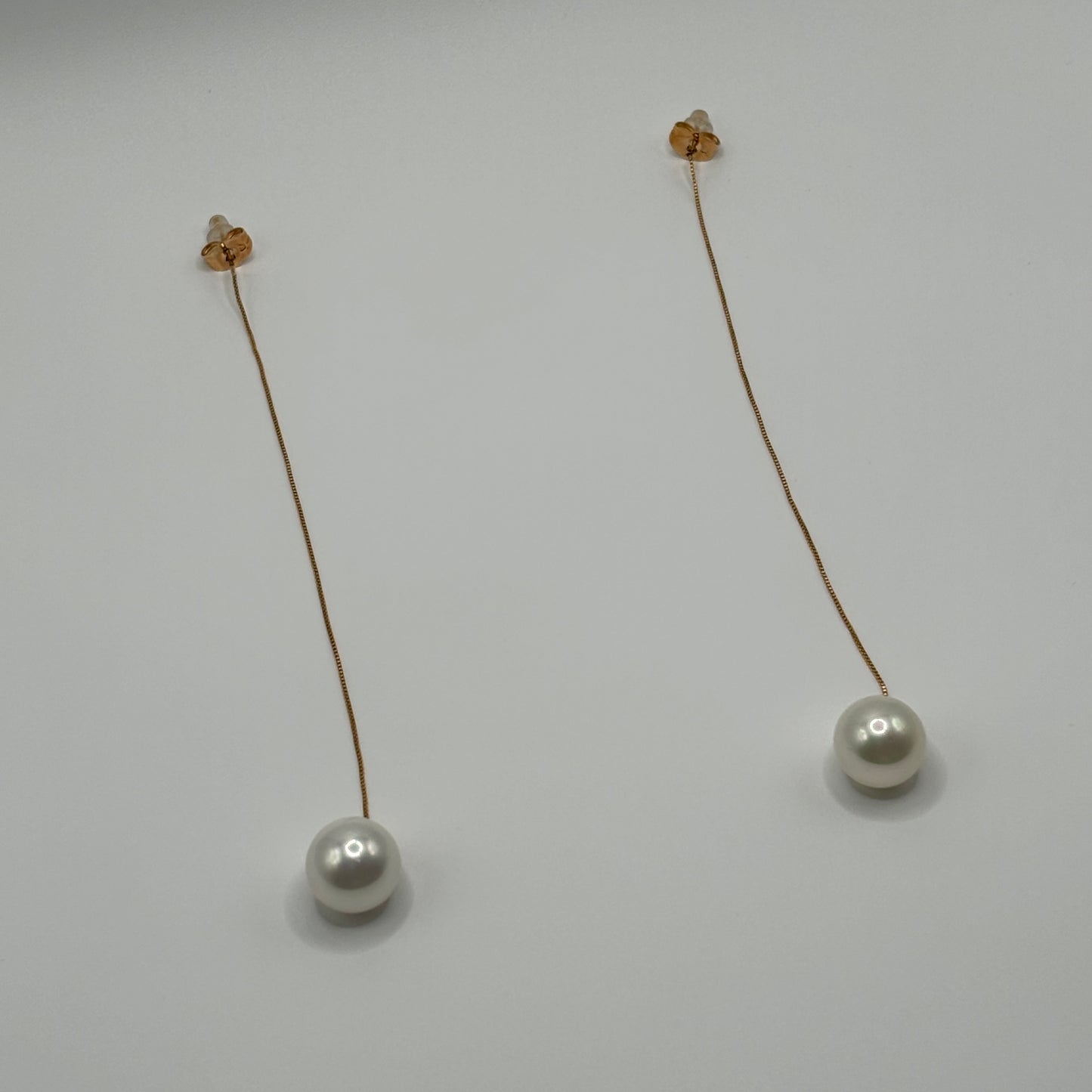 Solitary Luster: The Single Pearl Drop Earrings