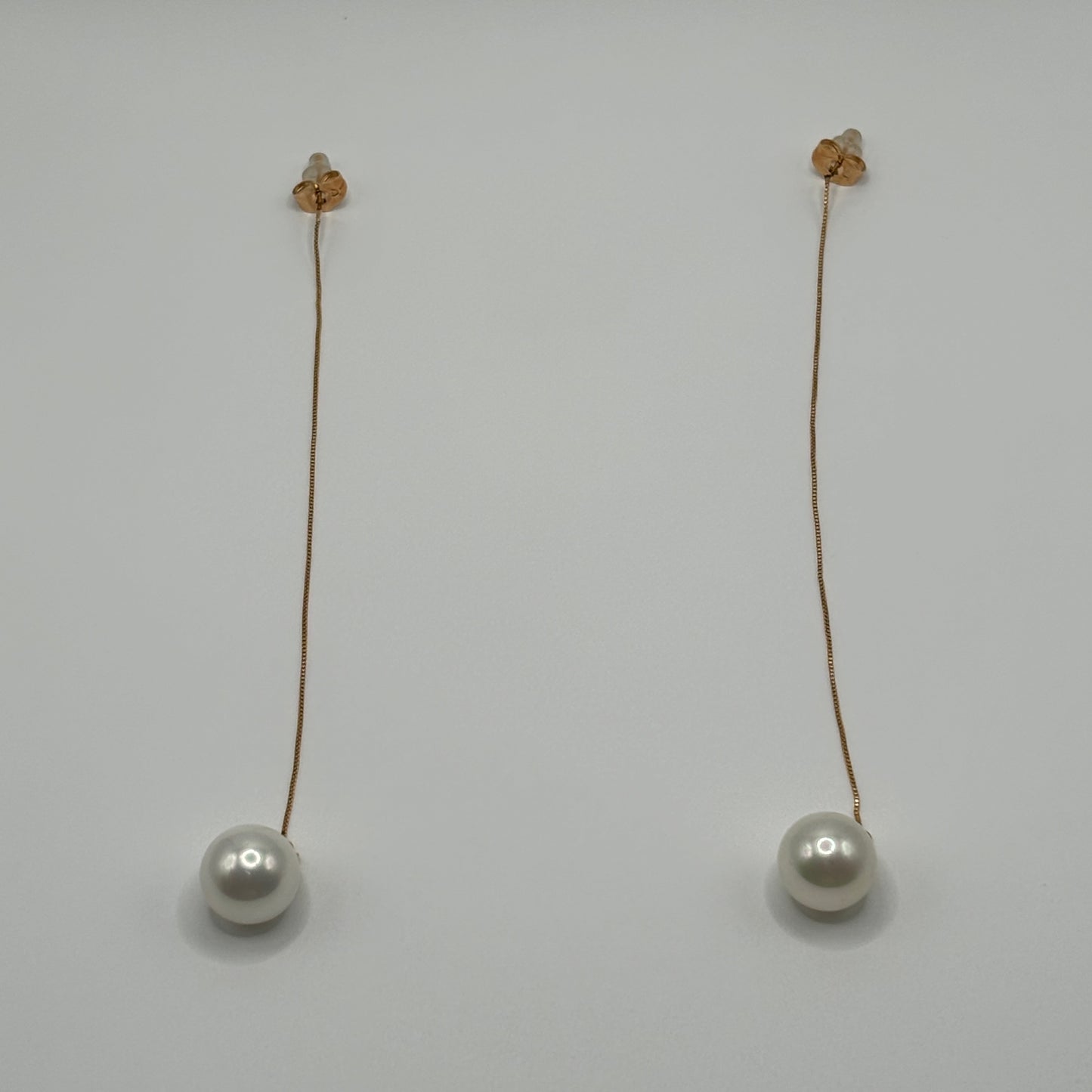 Solitary Luster: The Single Pearl Drop Earrings