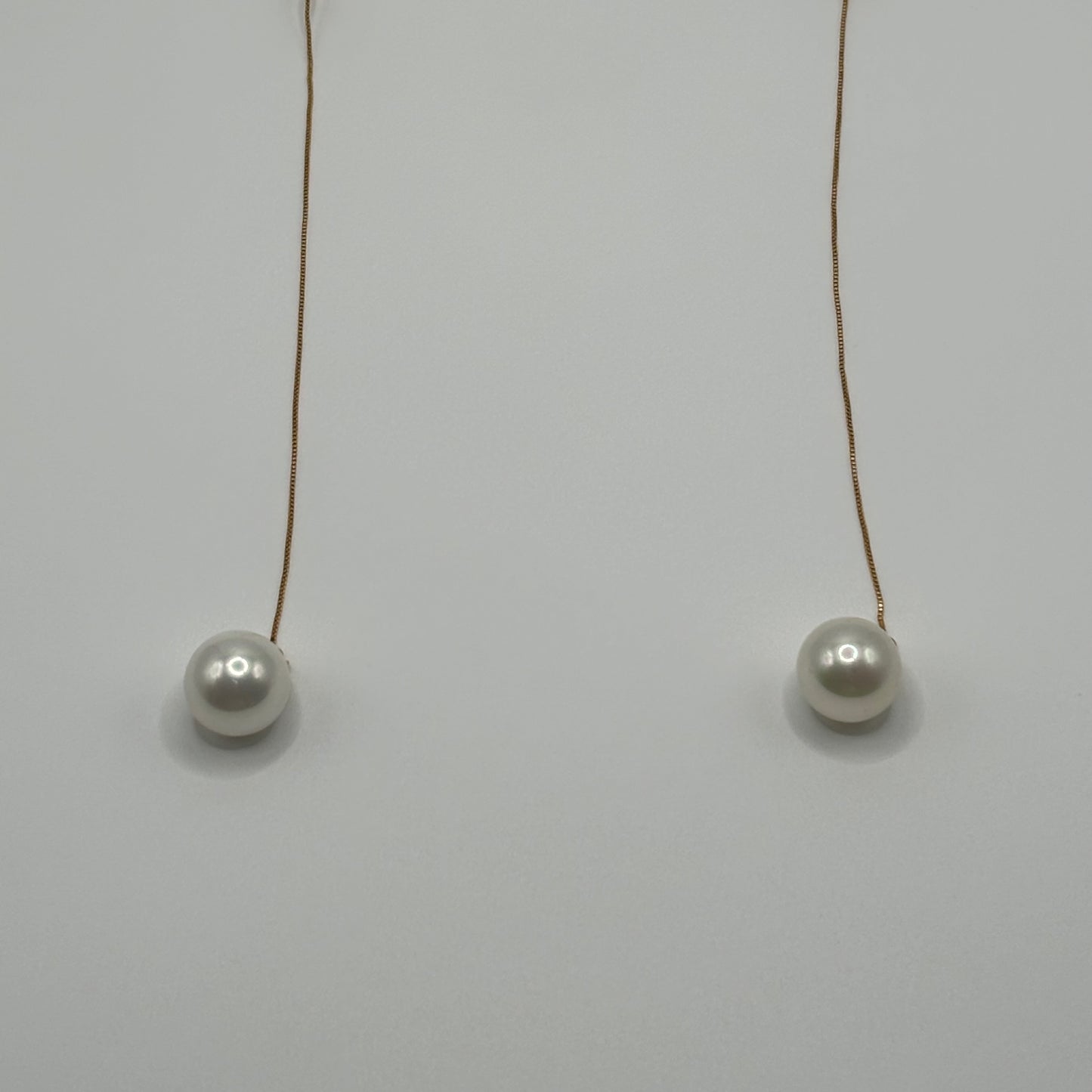 Solitary Luster: The Single Pearl Drop Earrings