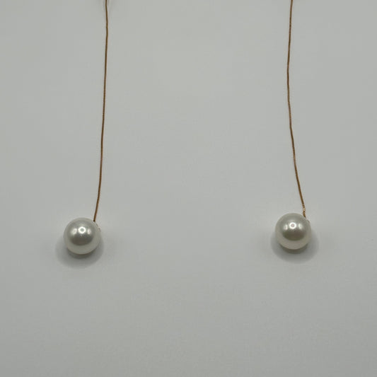 Solitary Luster: The Single Pearl Drop Earrings