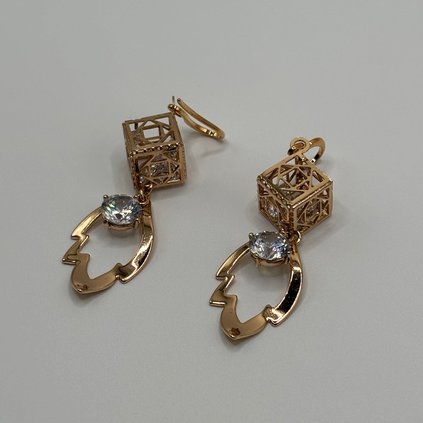 Geometric Glamour: The Gilded Cage Crystal Earrings