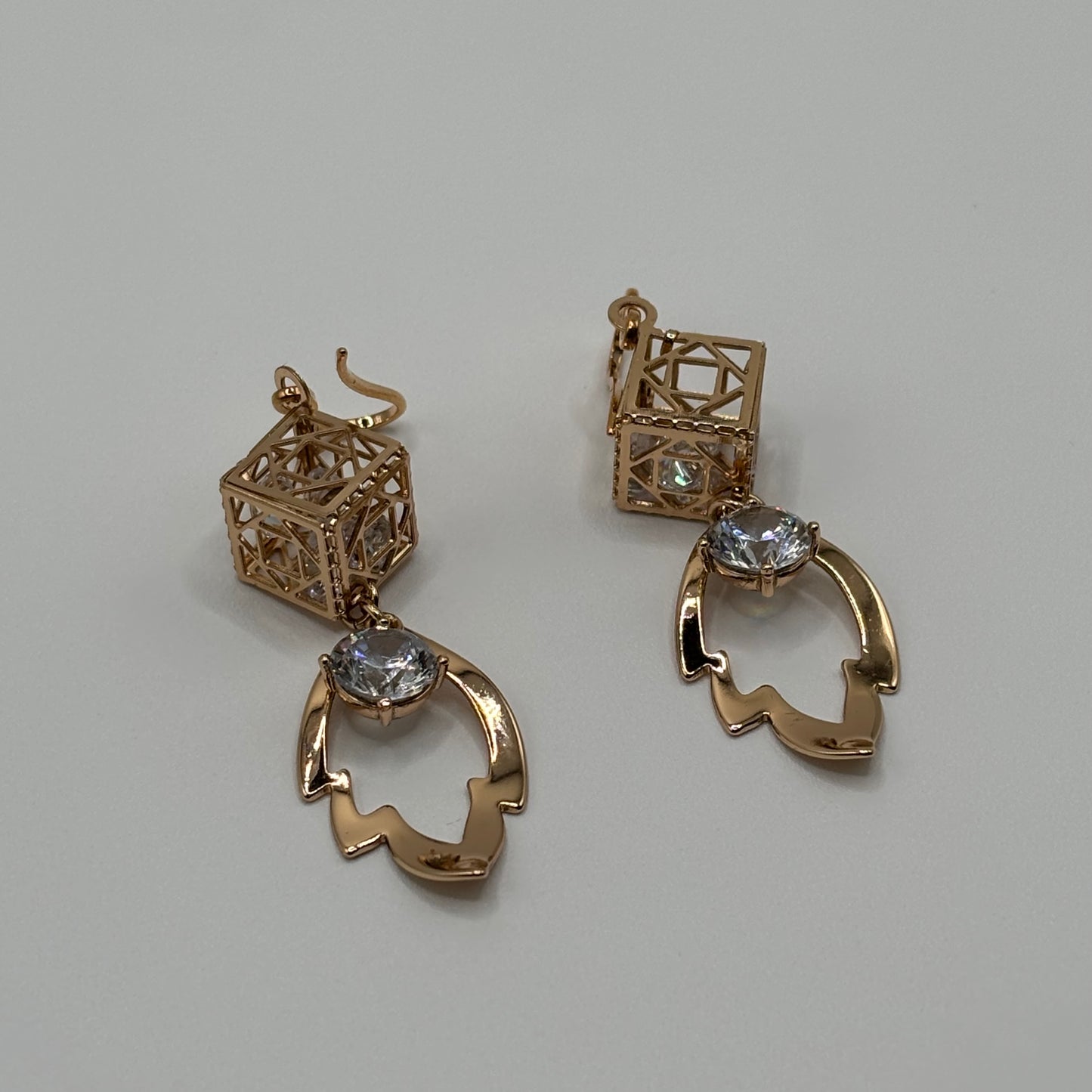 Geometric Glamour: The Gilded Cage Crystal Earrings