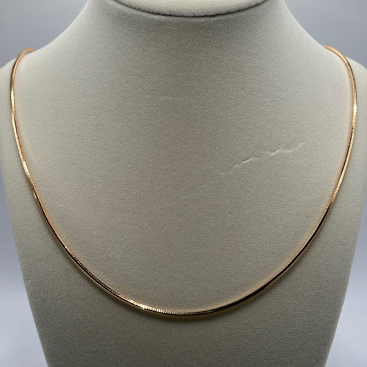 Silken Gleam: The Smooth Golden Omega Necklace